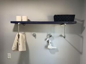 Shower, rainfall showerhead, hair dryer, towels