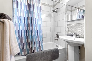 Combined shower/tub, towels, soap, shampoo