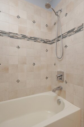Bathtub, soap, shampoo, toilet paper