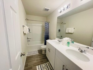 Combined shower/tub, hair dryer, towels, soap