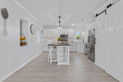 Stunning Custom Home. Walk to the Beach. Heated POOL! Elevator!
