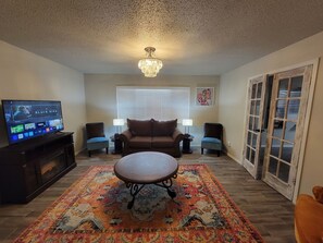 Smart TV, fireplace, books