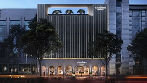 A modern building with a 'Citadines CONNECT' sign, featuring a vertical facade and arched entrances. - Citadines Connect City Centre Singapore (Singapore)