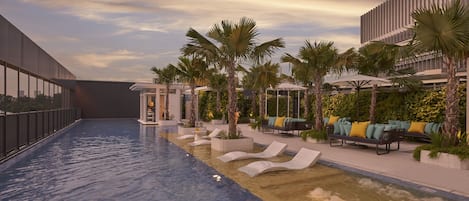 Outdoor pool, open 7:00 AM to 9:00 PM, pool loungers