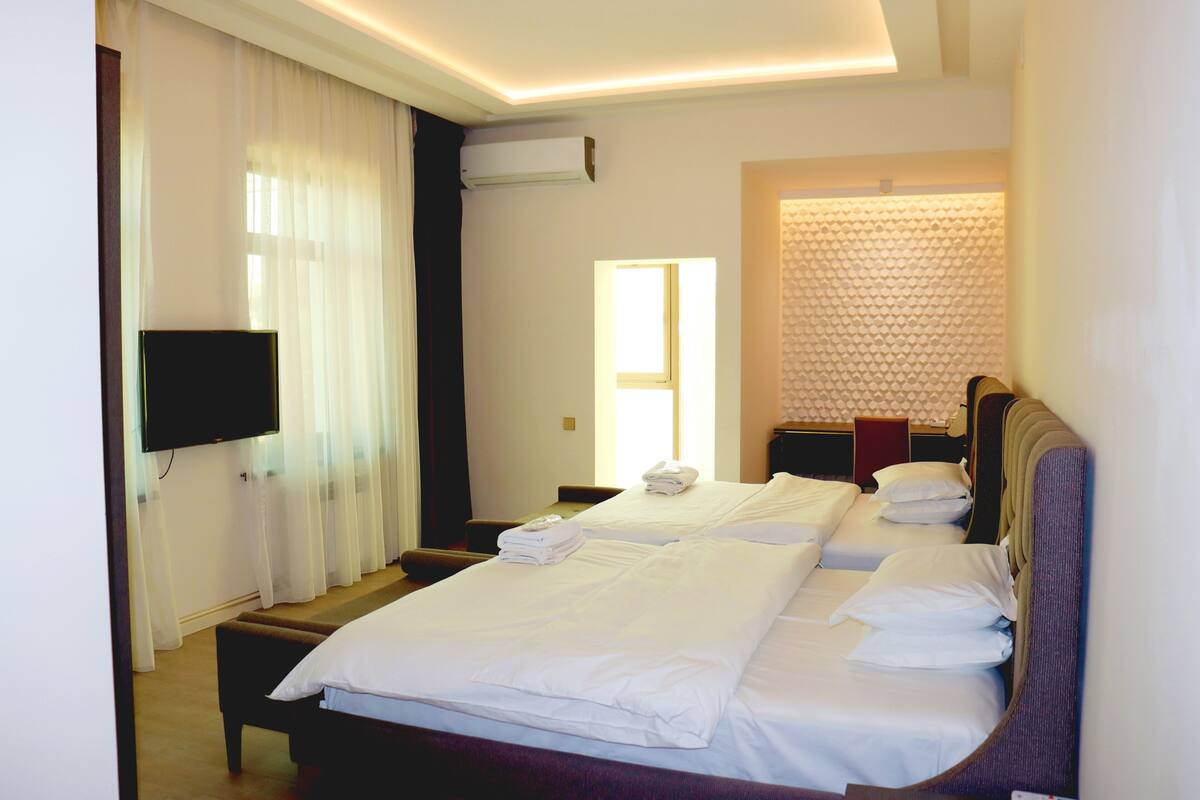 Premium bedding, memory foam beds, desk, laptop workspace
