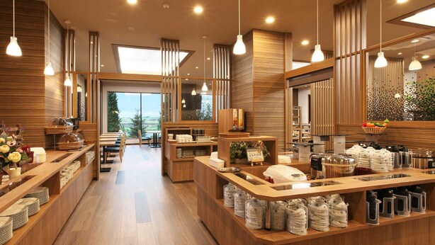 Un moderno vestíbulo de hotel con piso de madera, una recepción central y vistas al exterior.