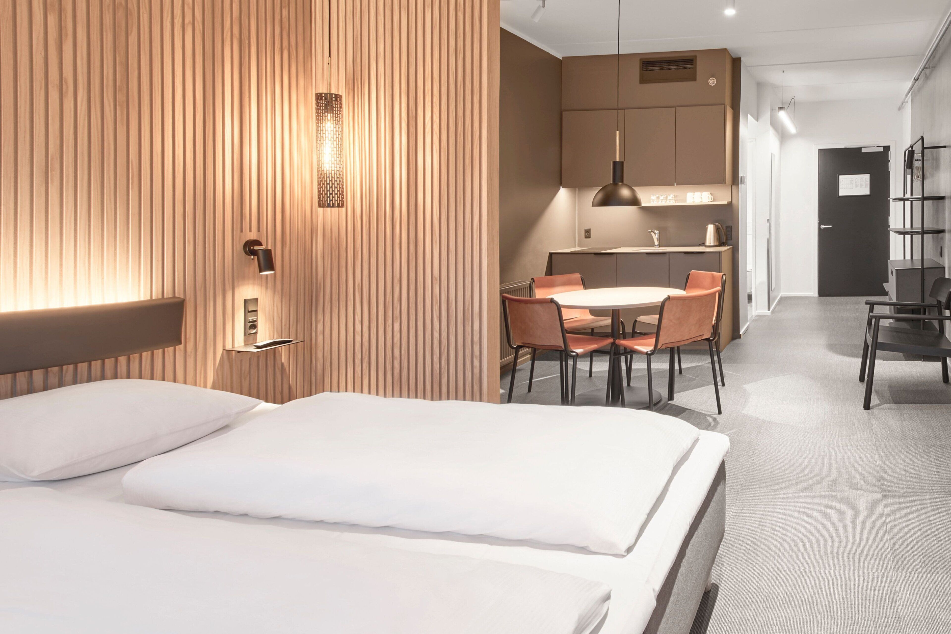 Desk, laptop workspace, blackout drapes, iron/ironing board