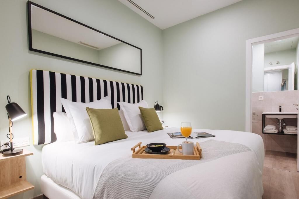 Desk, laptop workspace, bed sheets