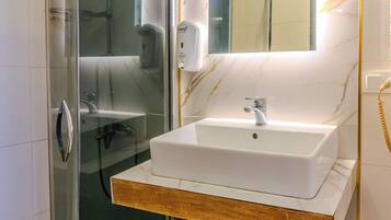 Shower, free toiletries, hair dryer, slippers