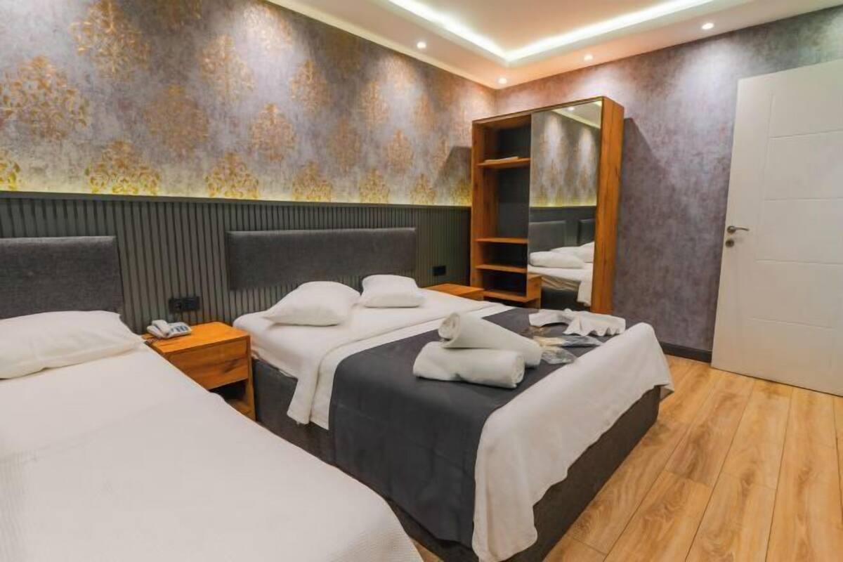 Desk, soundproofing, iron/ironing board (on request), bed sheets