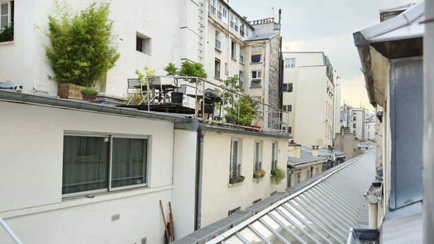 A narrow urban street with buildings on both sides. - Cosy Studio - Studio Apartment, Sleeps 2 (Paris)