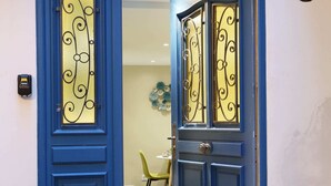 A blue door with a decorative glass panel and a keyhole. - St Honore - Two Bedroom Apartment, Sleeps 6 (Paris)