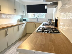 House, Multiple Beds | Private kitchen