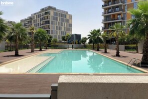 Outdoor pool - bnbme | Midtown By Deyaar Afnan District | STUDIO (Ajman)