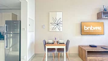 Deluxe Studio | Living area | 32-inch Smart TV with cable channels