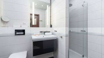 Shower, hair dryer, towels, shampoo
