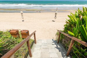 On the beach, white sand, free beach cabanas, sun loungers