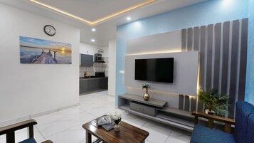 Luxury Apartment, 1 Bedroom | Living area | 40-inch flat-screen TV with cable channels, TV, heated floors