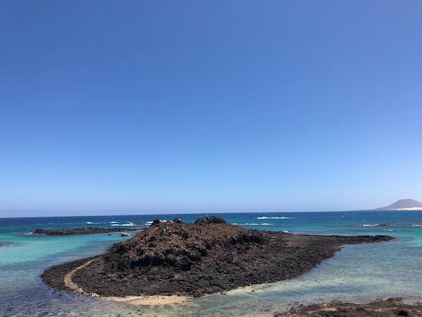 Platja a a prop, gandules de platja i tovalloles de platja