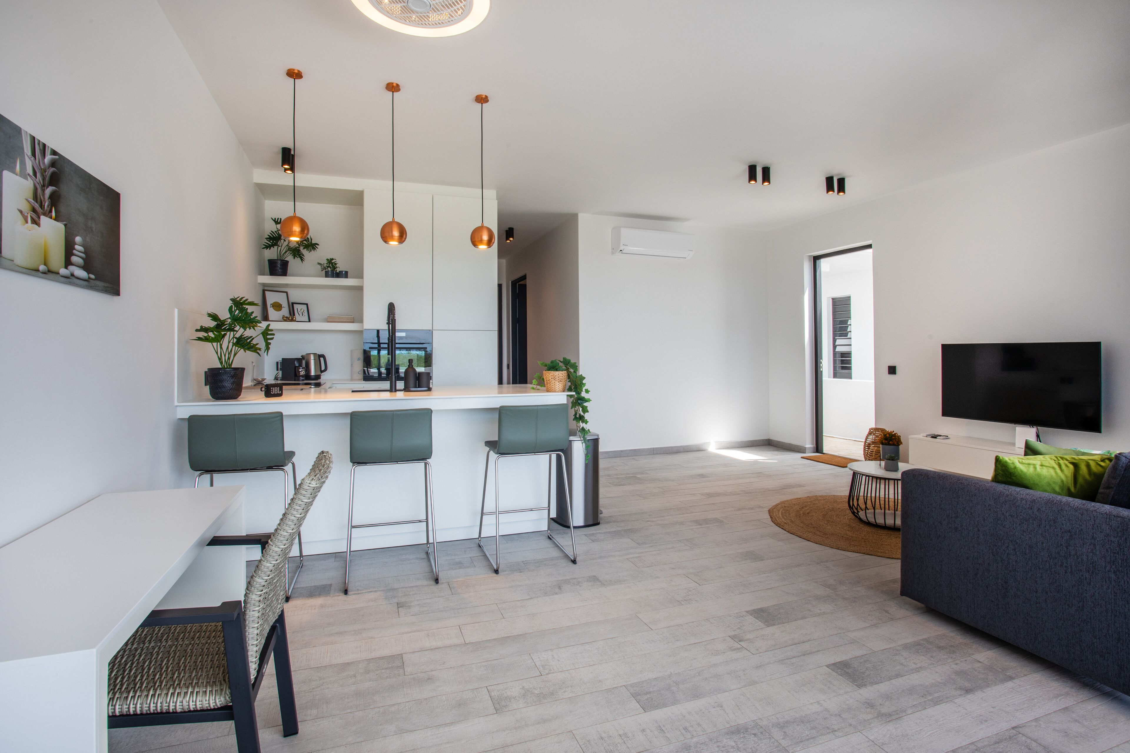 deluxe apartment | living area | 90-cm smart tv with cable channels, tv