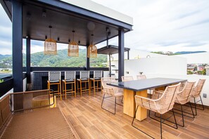 Outdoor dining - Modern 2BR Near Beach & Boardwalk | Gym & BBQ (Puerto Vallarta)