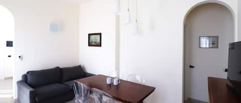 Apartment (2 Bedrooms) | Living area | 55-inch flat-screen TV with cable channels, TV