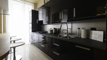 Comfort Apartment | Private kitchen | Full-size fridge, microwave, electric kettle, toaster