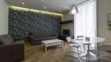 Comfort Apartment | Living area | 24-inch flat-screen TV with cable channels, TV