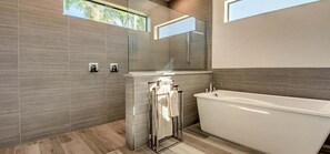Bathtub, hair dryer, towels