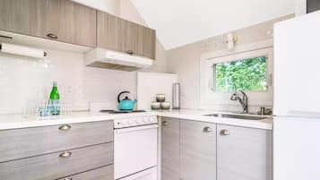 Fridge, microwave, cookware/dishes/utensils, dining tables