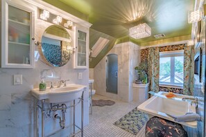 Bathtub, hair dryer, towels, soap