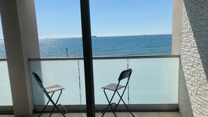 A balcony with two chairs and a clear view of the sea. - 24 Breakwaters - Sandown Bay - Isle of Wight (Sandown)