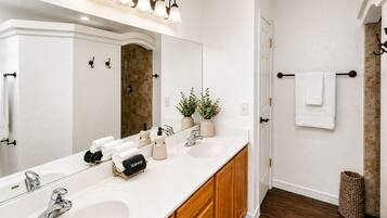 Bathtub, hair dryer, towels, soap