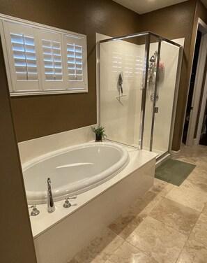 Combined shower/tub, hair dryer, towels, soap