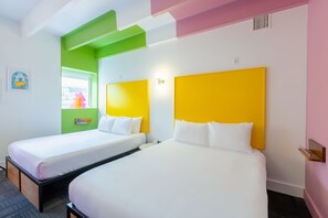 Two single beds with white bedding, a green accent wall, and a window with a view. - The Gallatin(2 Queen Suite 115) Colorful Boutique Hotel! (Nashville)
