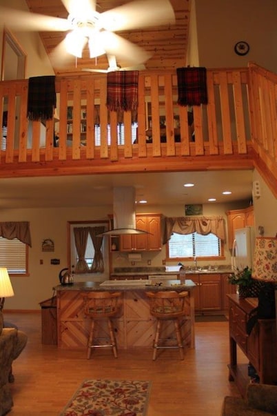 Pond side cabin nestled in the woods