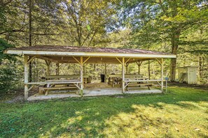 A wooden picnic shelter with benches, surrounded by trees. - 'The Creek' Winfield Gem: 73 Acres of Privacy (Winfield)