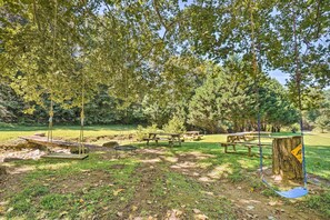 A park with swings, picnic tables, and a wooden bench. - 'The Creek' Winfield Gem: 73 Acres of Privacy (Winfield)