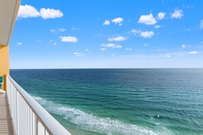 A balcony with a view of the ocean and a clear sky. - Treasure Island 1806 (Panama City Beach)