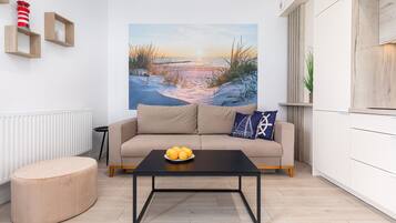 Deluxe Apartment | Living area | 55-inch LED TV with digital channels, TV