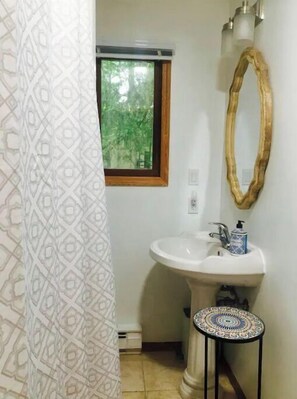 Bathtub, hair dryer, towels, soap