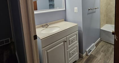 Family sized updated cottage with garage -Fenced in yard for pets..
