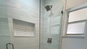 A glass-enclosed shower with a tiled floor, a handheld showerhead, and a control panel. - Excellent location Miami Brickell Studio 1.7 Miles from the Beach (Miami)
