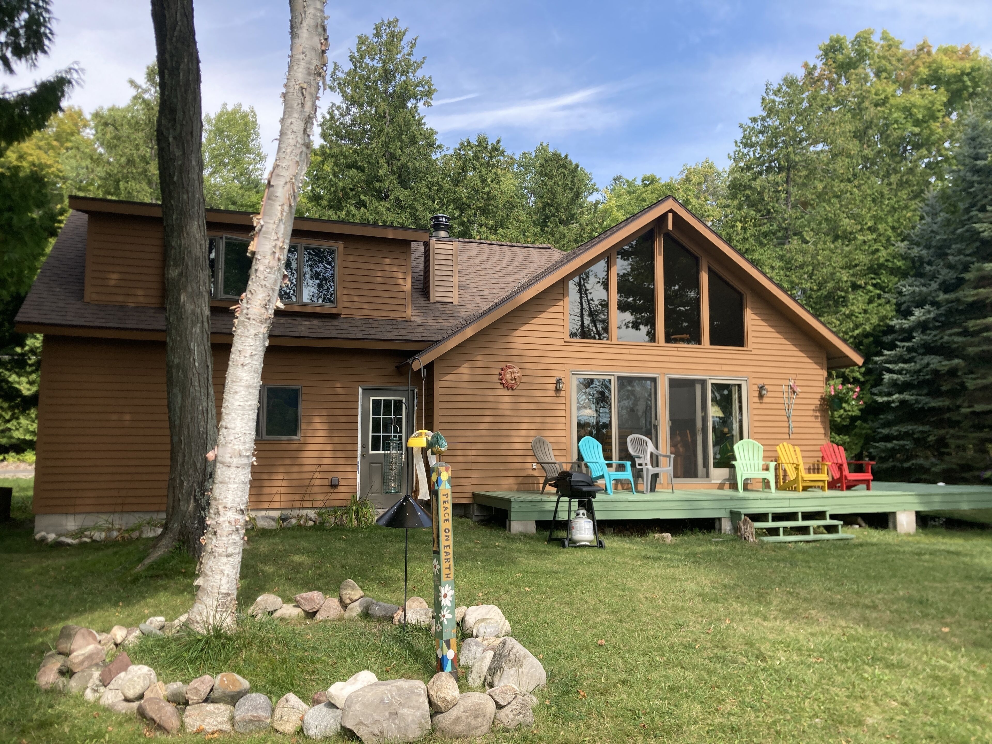 Beautiful 3 bedroom cedar chalet right on Little Traverse Lake, Leelanau County!