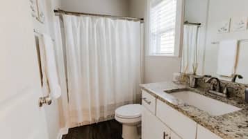 Combined shower/tub, hair dryer, towels, soap