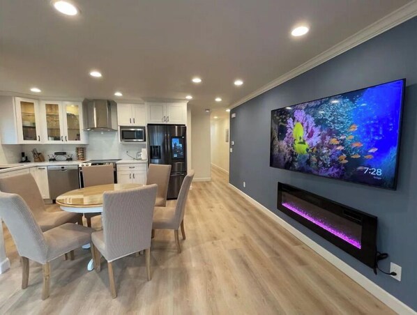 A modern kitchen with white cabinets, a built-in microwave, and a stainless steel refrigerator. - New Coastal Home🐠 Steps to pier🐢 16mins to SFO✈️ (Pacifica)