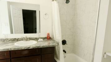 Combined shower/bathtub, hair dryer, towels, soap