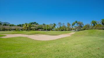 Enjoy a round of golf amidst lush greenery and scenic views.