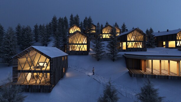 A series of wooden cabins with large windows, surrounded by snow-covered trees.