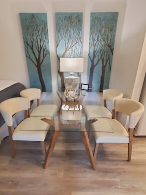 Enjoy meals in this stylish dining area with a glass-top table and comfortable seating for six.